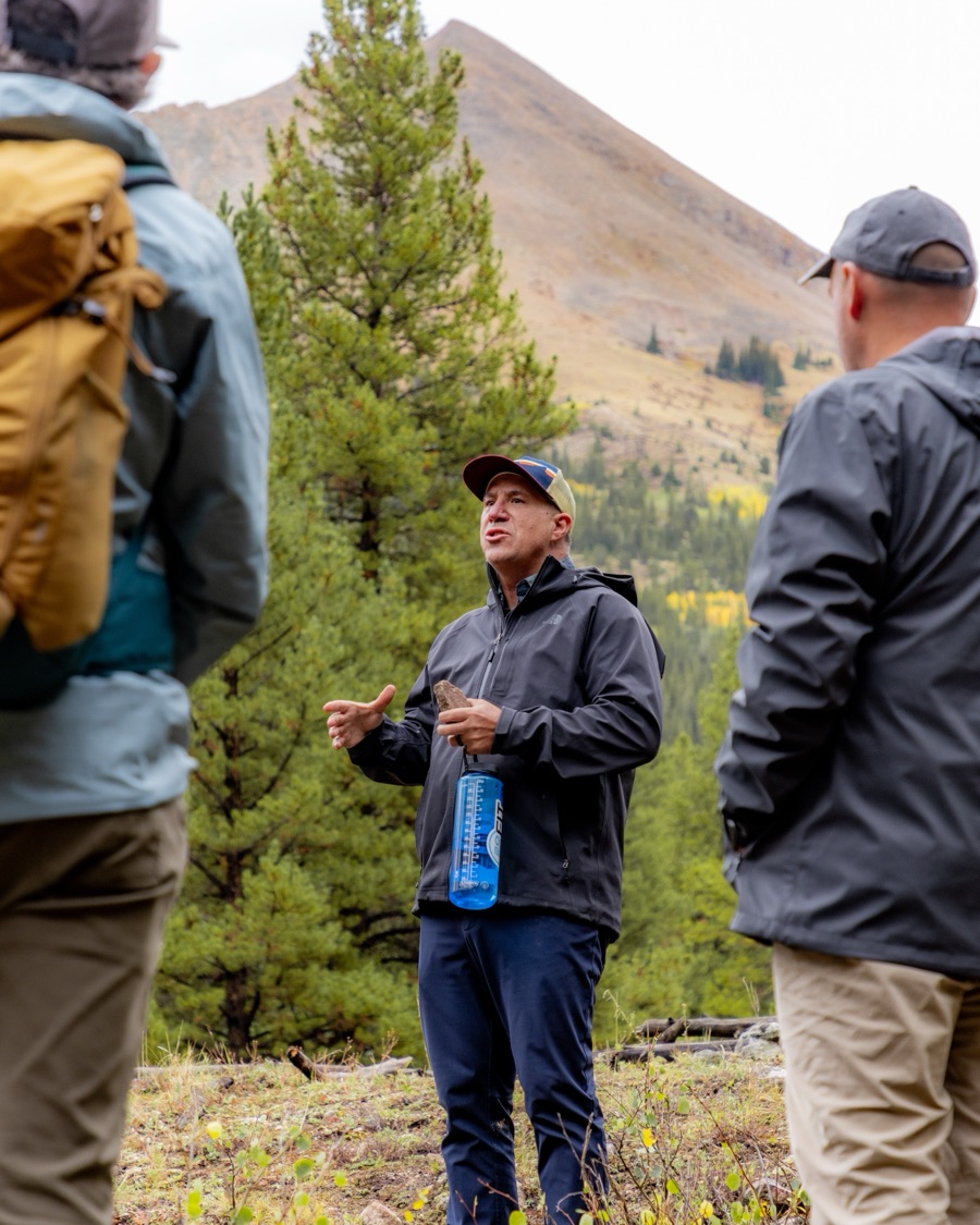 A Lost Ball leader talking with a group on a Colorado mountain trail